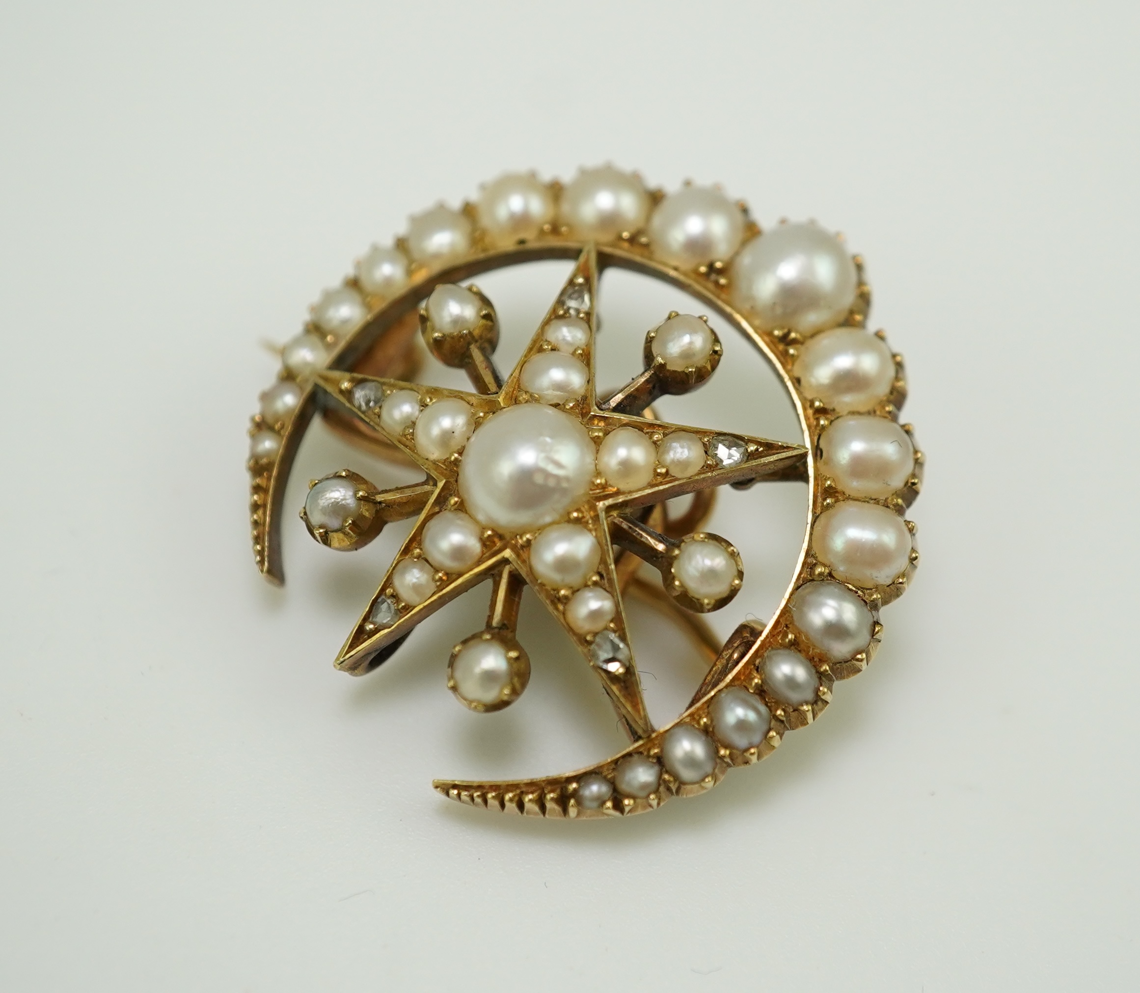 An Edwardian half pearl and diamond brooch, early 20th century